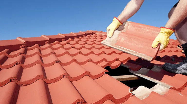 ServiceFind-verified roofing professional conducting a post-storm hail damage assessment